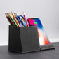 leather pen holder wireless charger with colorful pens and a smartphone on a desk